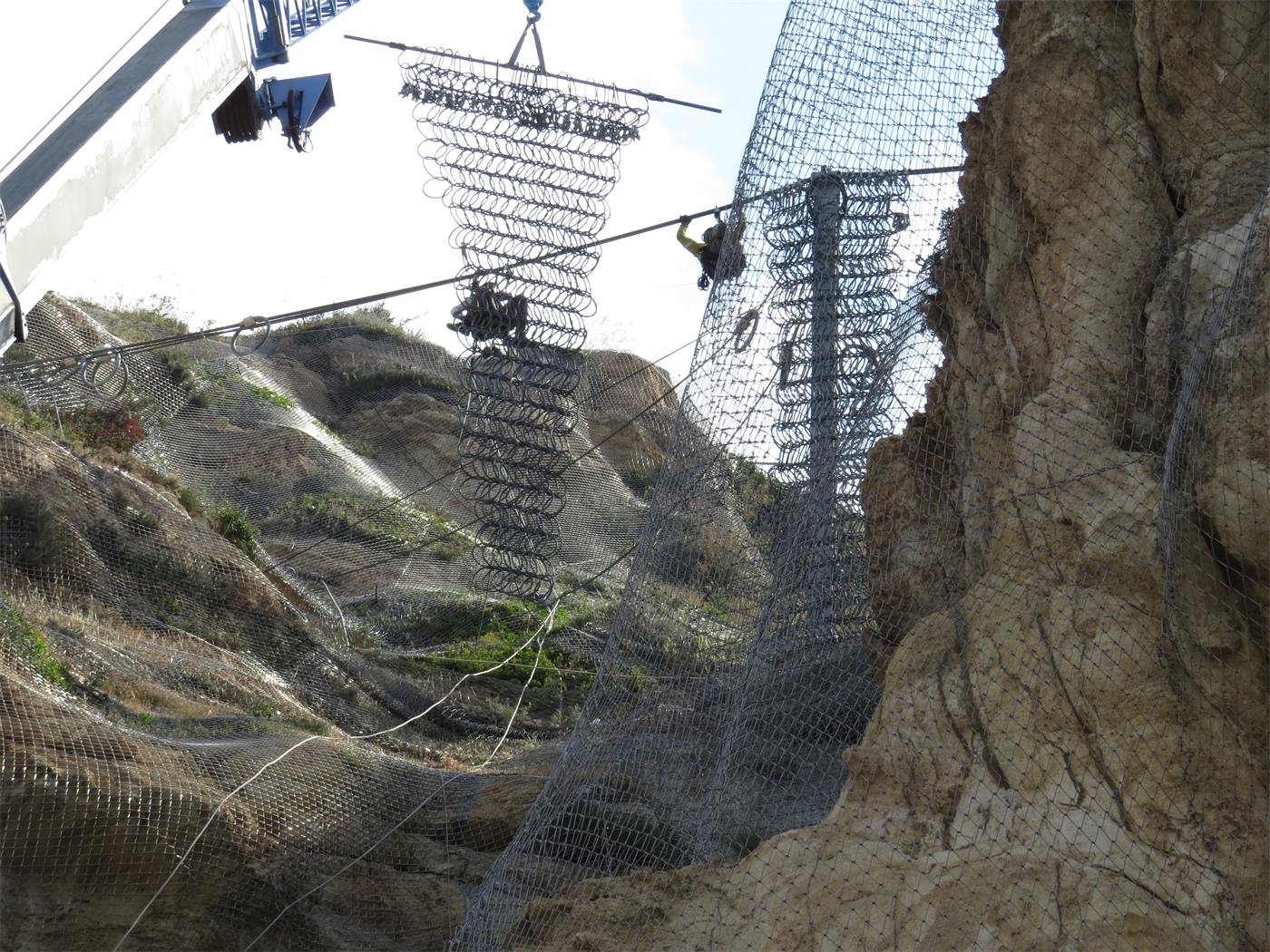 Mesh panel installation by crane