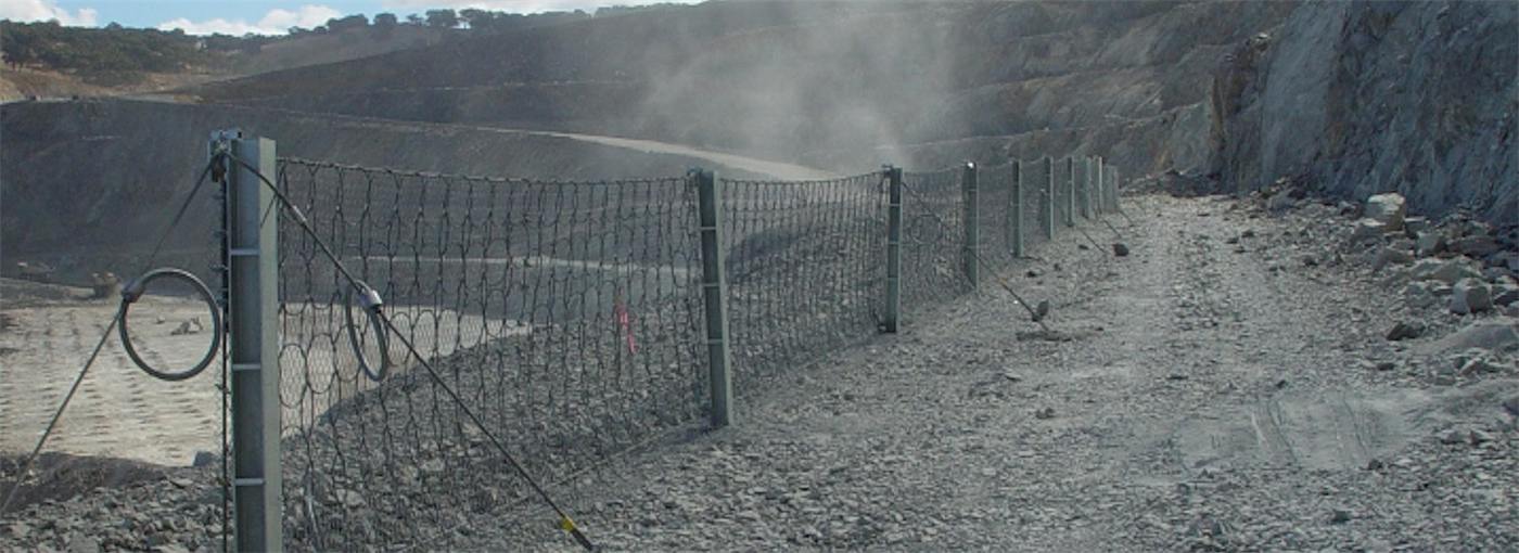 Catch fence protecting a mine haul road